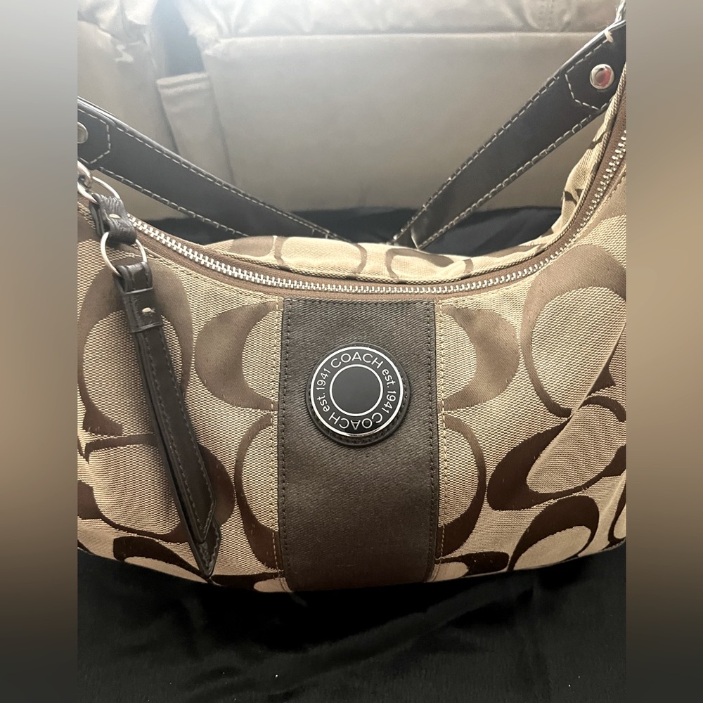 Brown signature Coach handbag
